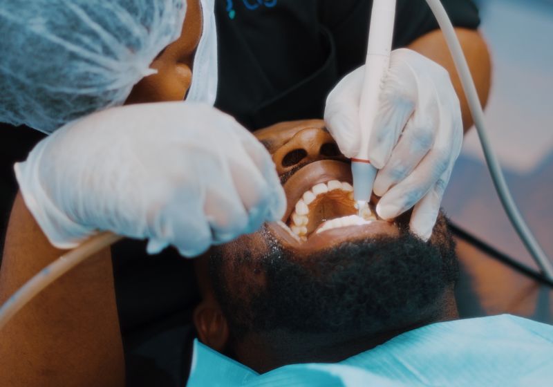 Dental hygienist performing a professional teeth cleaning